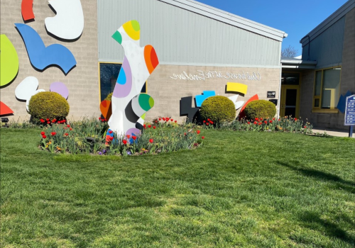 Enclaves exterior with spring flowers